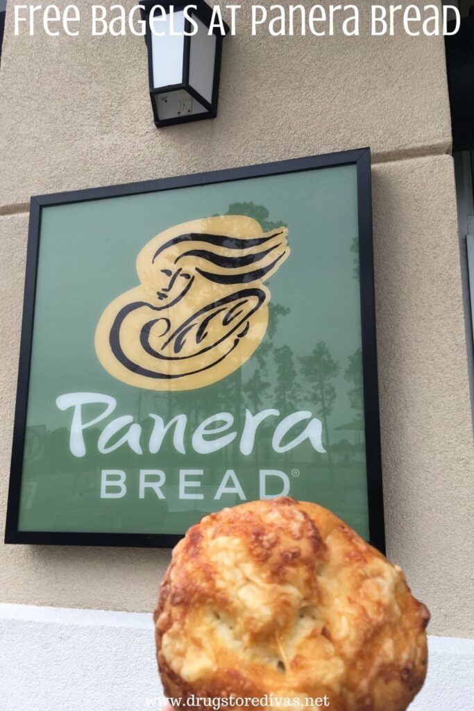 Bagel in front of a Panera Bread sign.