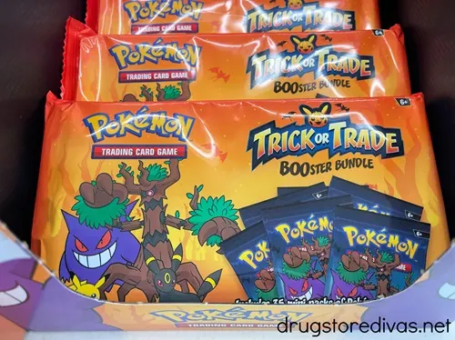 Unopened packs of Halloween Pokemon cards in a box.