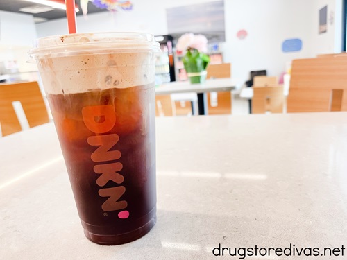 A cold brew coffee with cold foam in a Dunkin'.