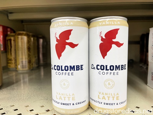 Two cans of La Colombe coffee on a shelf.