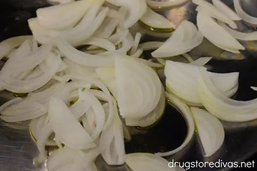 Sliced onions in a pan.
