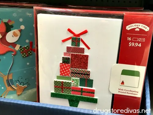 Christmas cards on a store shelf.
