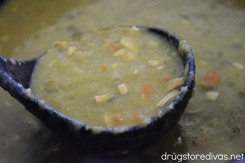 A spoonful of slow cooker split pea soup with chicken.