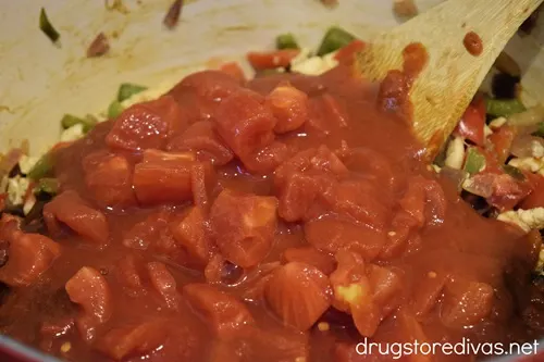 Canned tomatoes in a Dutch oven.