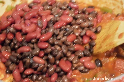 Two colors of beans in a Dutch oven.