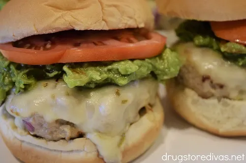 Two guacamole turkey burgers with pepper jack cheese.