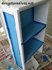 Updating an old bookcase is so easy. Just repaint it! Find out more at www.drugstoredivas.net.