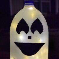 Milk Jug Ghost lit up with the words 