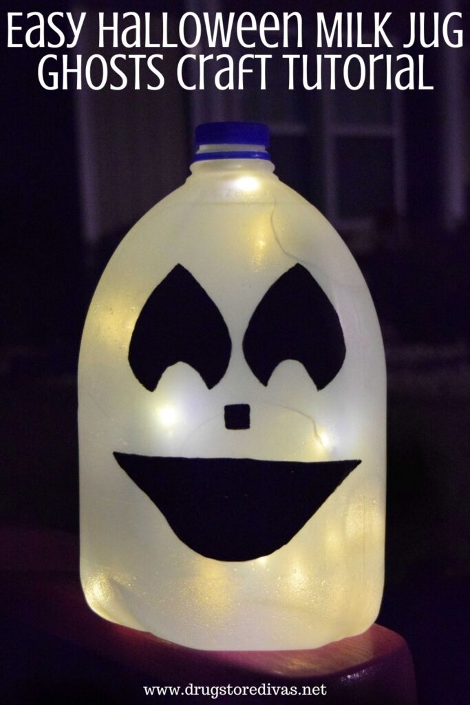 Milk Jug Ghost lit up with the words "Easy Halloween Milk Jug Ghosts Craft Tutorial" digitally written on top.