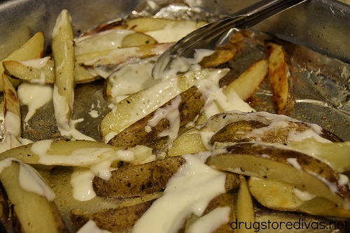 This Creamy Cheesy Steak Fries recipe is the perfect side dish for burgers or chicken. They're covered in ranch, sour cream, cheese, and more.