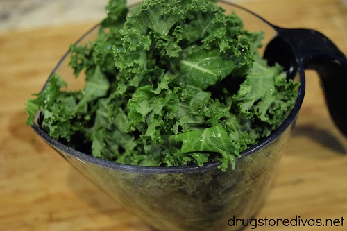 Kale in a measuring cup.