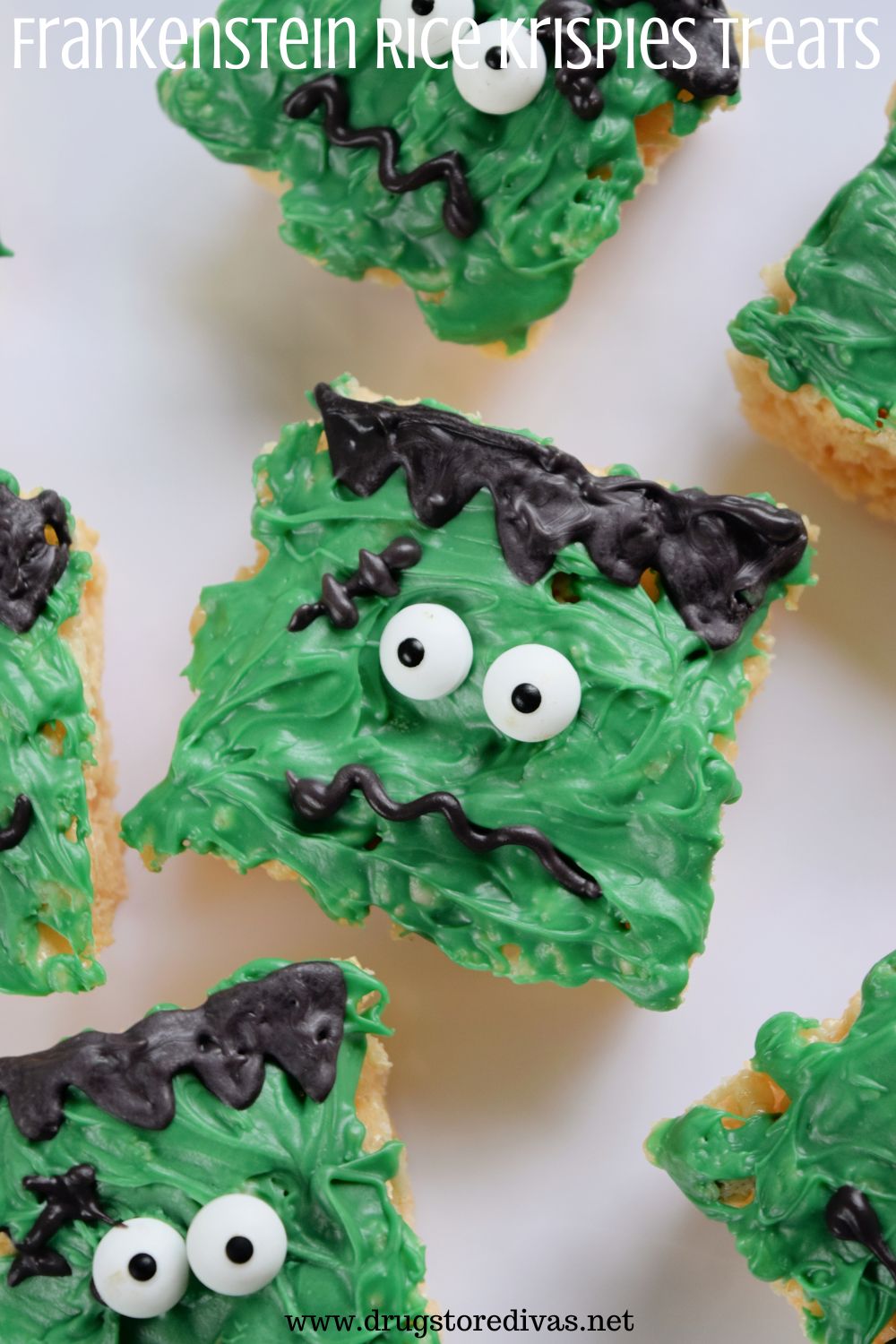 Six Rice Krispies treats decorated to look like Frankenstein, on a white tray, with the words 
