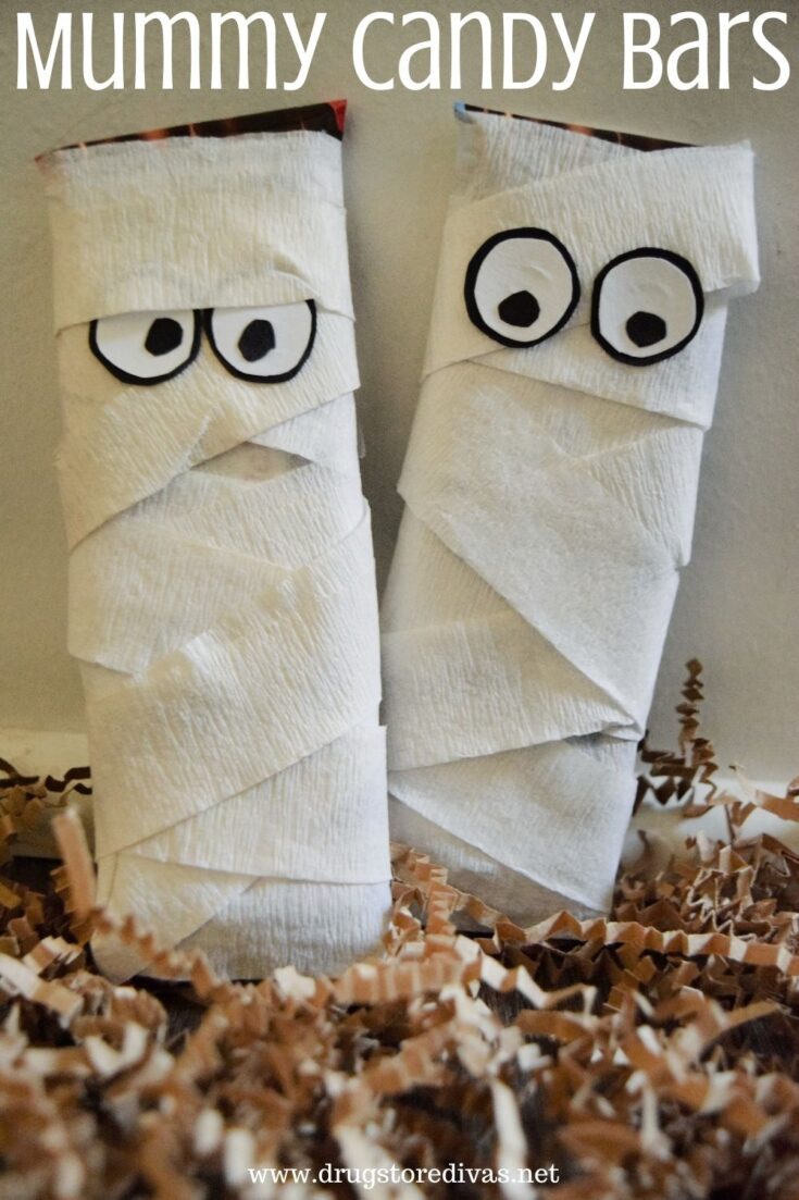 Two candy bars dressed up to look like mummies.