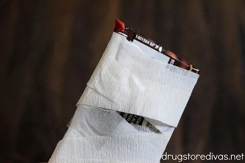 White streamer wrapped around a candy bar and taped at the top.