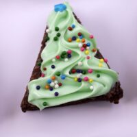 A brownie, decorated to look like a Christmas tree, with the words 