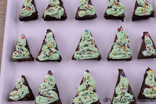 A bunch of brownie Christmas trees on a pan.