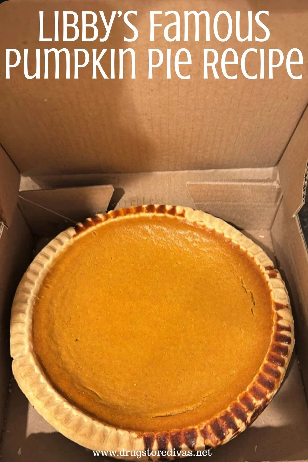 A pumpkin pie in a box with the words 