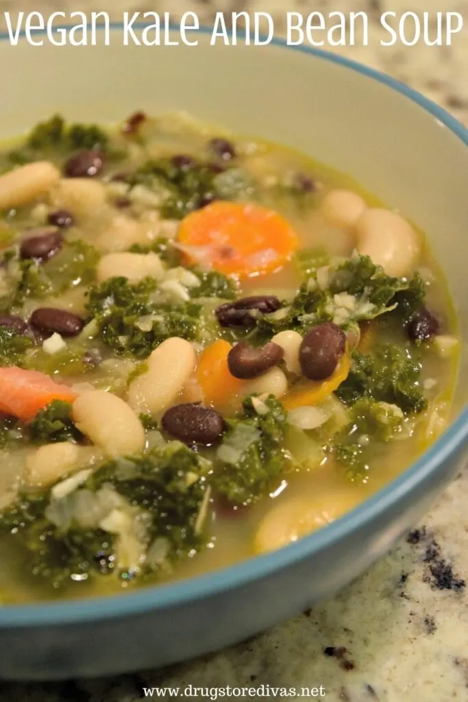 Bowl filled with beans, carrots, and kale and the words "Vegan Kale And Bean Soup" digitally written above it.