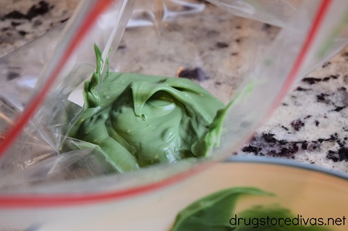 Melted green chocolate in a ziptop bag.