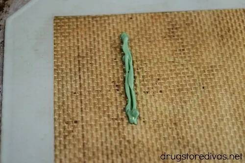 A green chocolate line on a silicone baking mat.