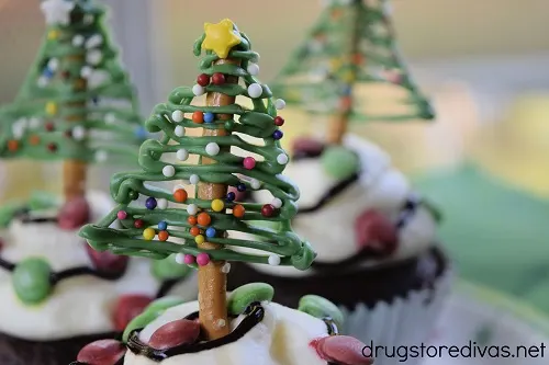 Three Chocolate Christmas Tree Pretzels on Christmas cupcakes.