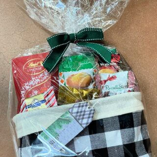 A wrapped gift basket with the words 