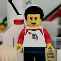 LEGO figure on a playset with the words 