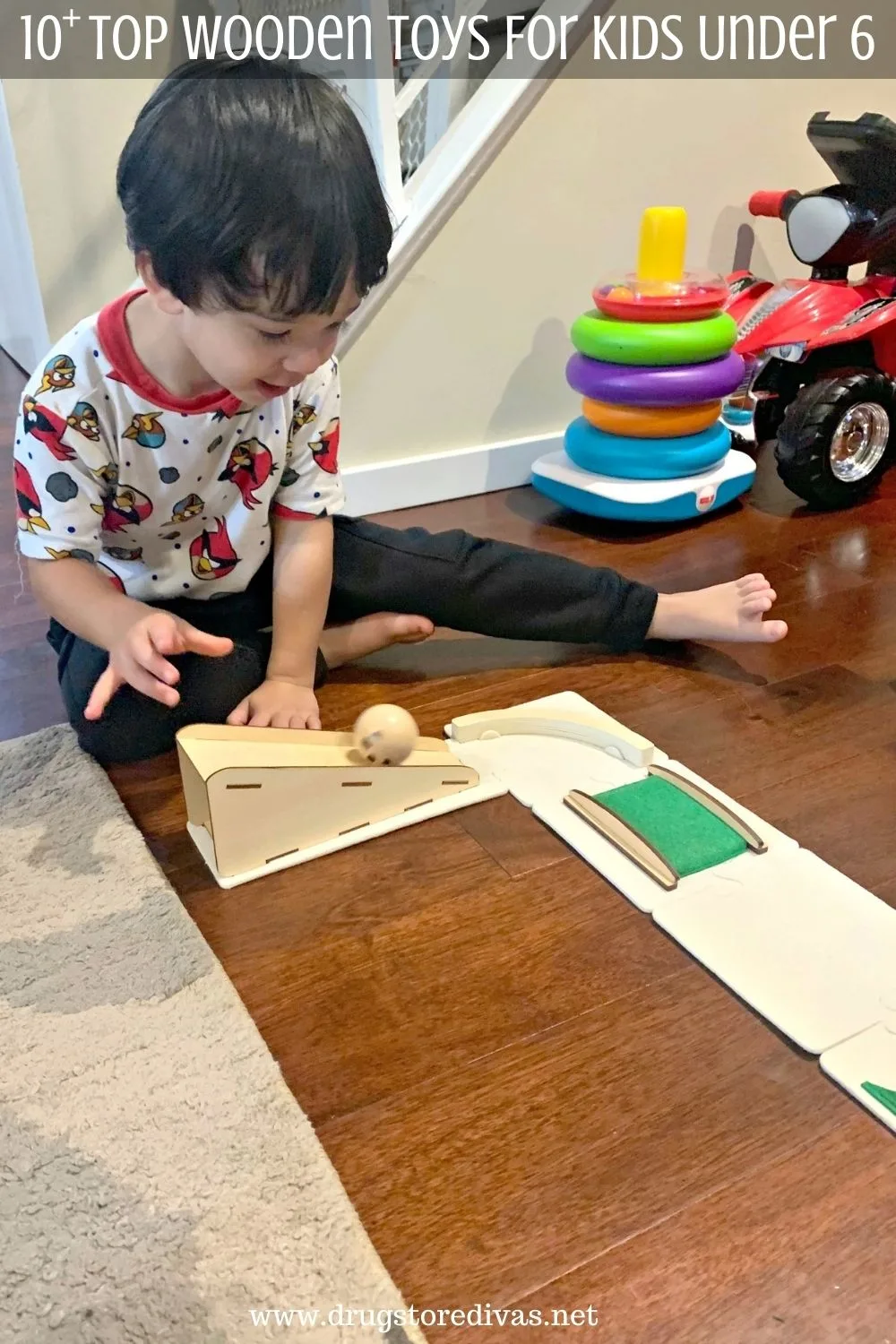 A boy playing with wooden toys.