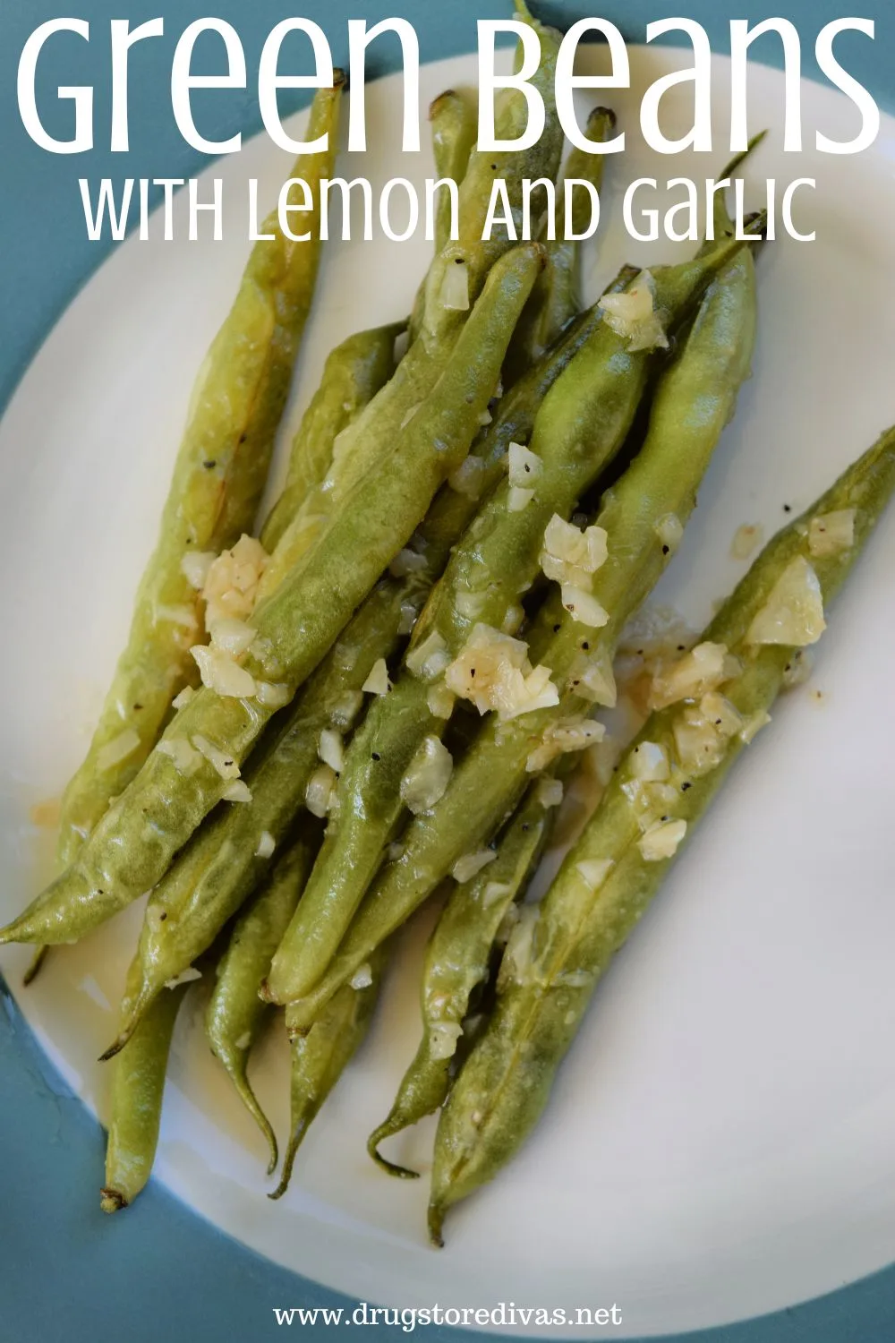 A bunch of cooked green beans on a blue and white plate with the words 