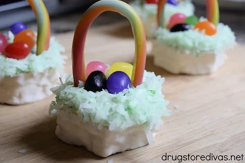 Four mini Easter basket cakes on a tray.