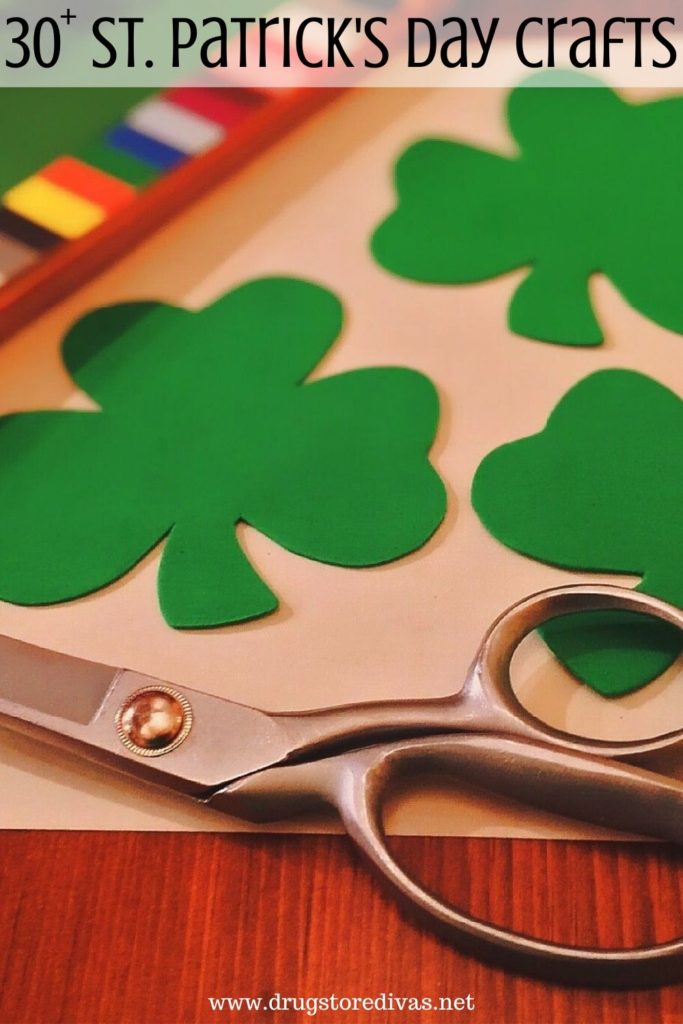 Shamrocks cut from cardstock with scissors and the words "30+ St. Patrick's Day Crafts" digitally written on top.