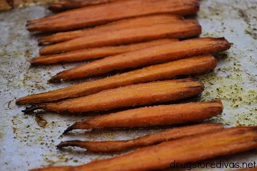 Oven roasted carrots on a sheet pan.