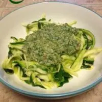 Zoodles and pesto in a bowl.
