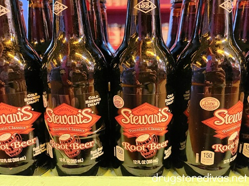 Bottles of Stewart's Root Beer on a shelf.
