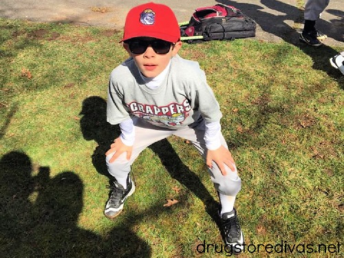 A boy in a baseball player Halloween costume.