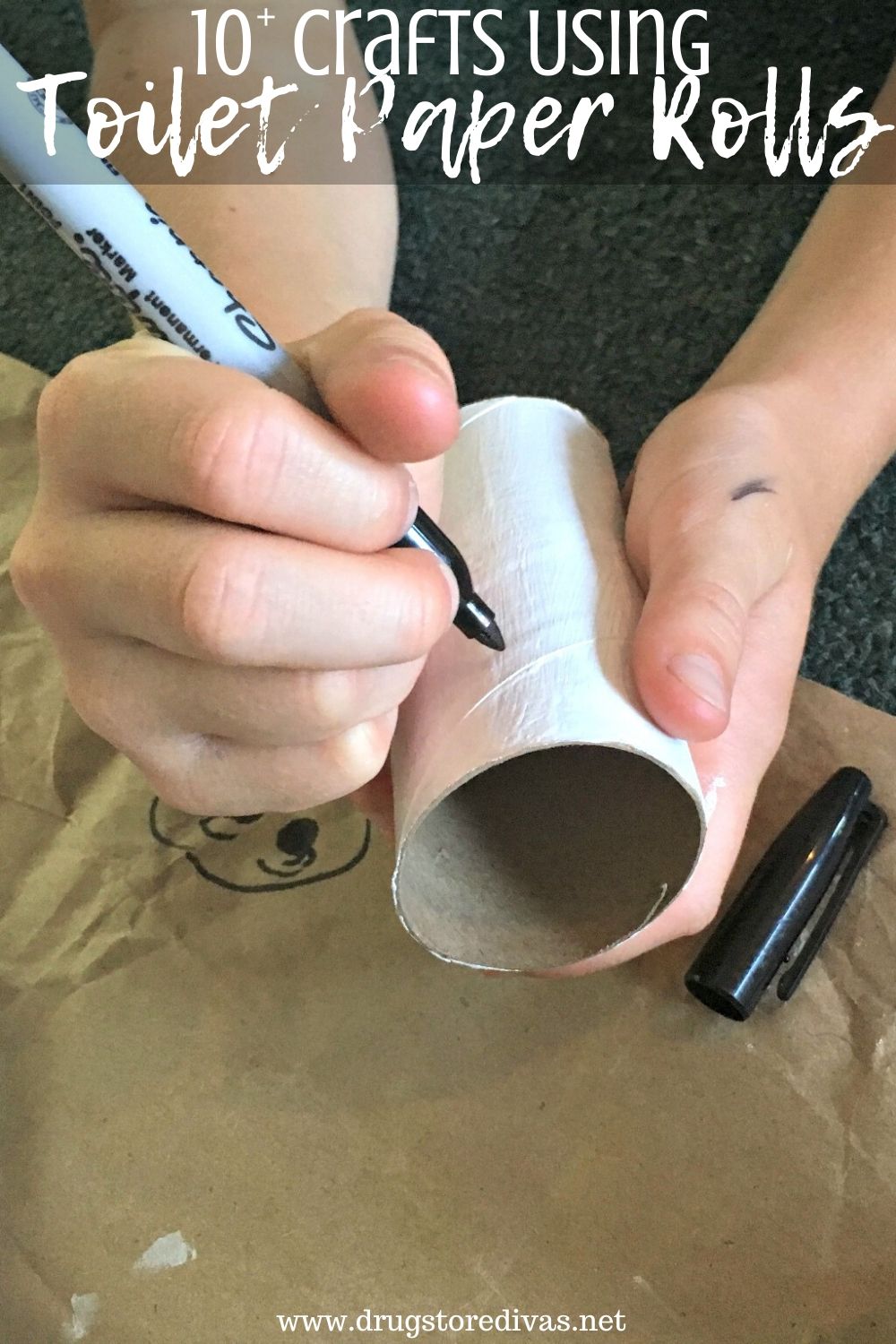 Kid drawing on a toilet paper roll with a marker and the words "10+ Crafts Using Toilet Paper Rolls" digitally written on top.