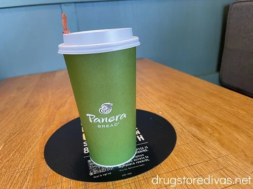 A Panera Bread to go coffee cup.