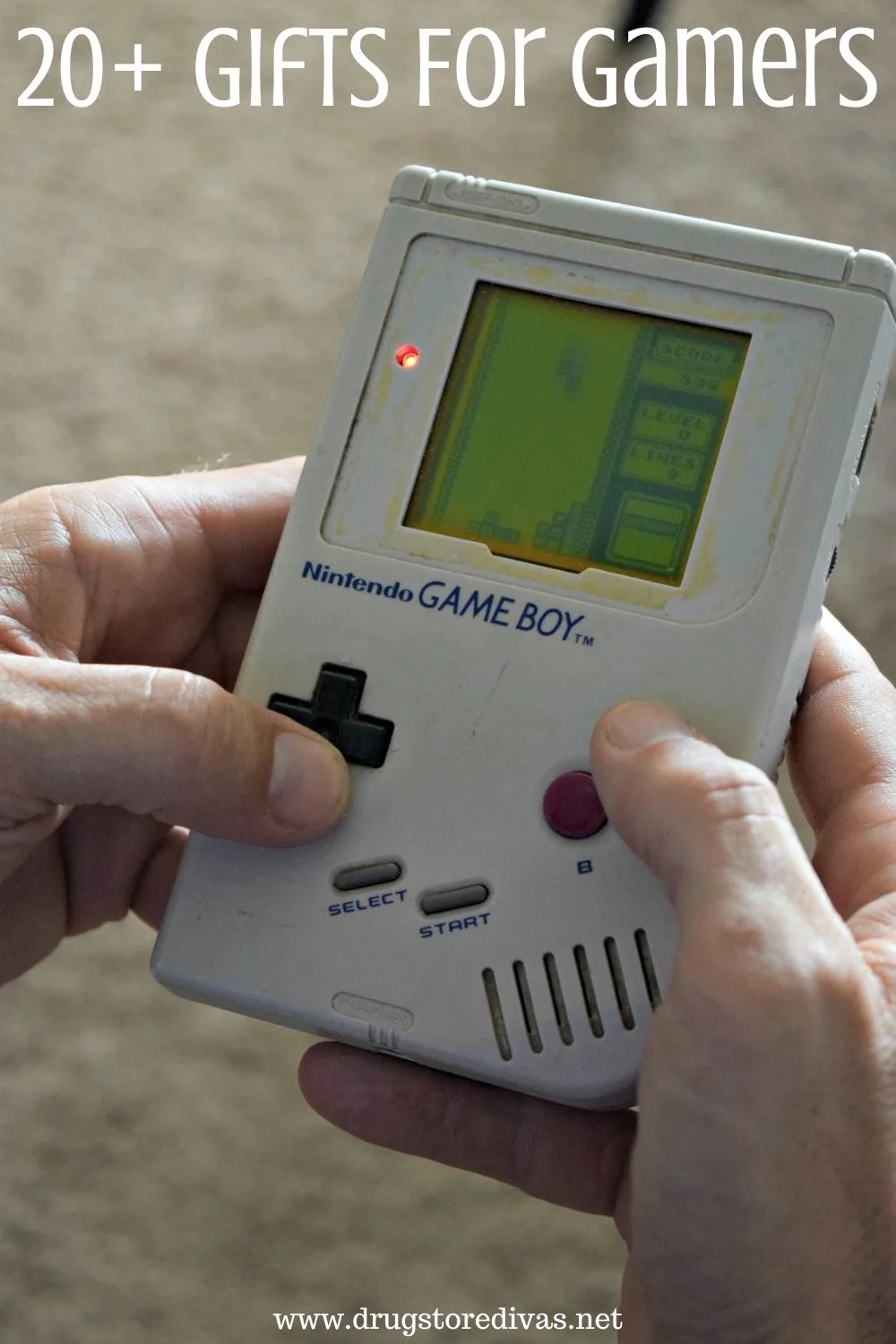 Hands around a Nintendo Game Boy with the words 