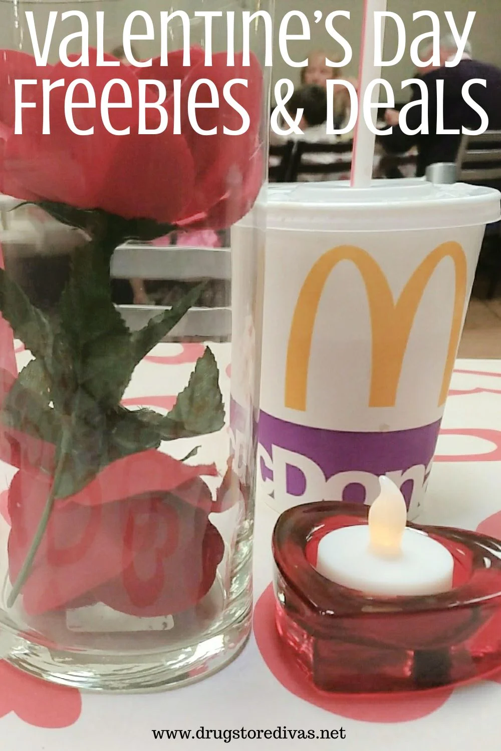A flower in a vase next to a McDonald's cup with a candle in front and the words 