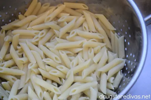 Penne pasta in a colander.