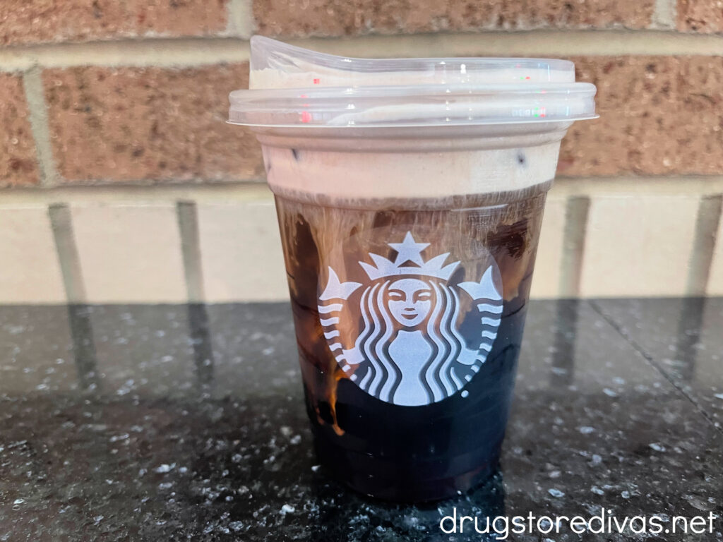 A Starbucks cold brew with cold foam on a counter.