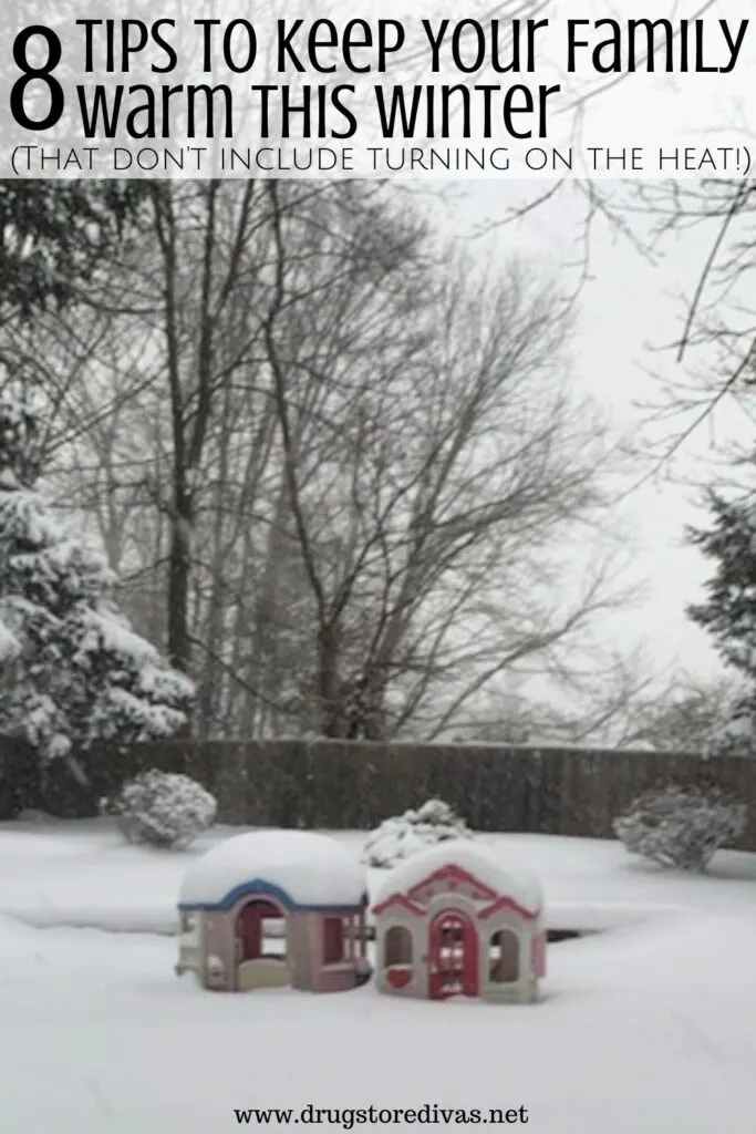 A playhouse covered in snow with the words "Tips To Keep Your Family Warm This Winter" digitally written on top.