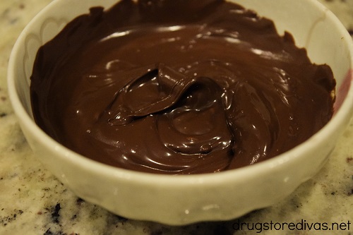 Melted chocolate in a white bowl.