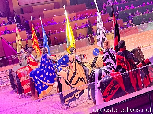 Six horses and knights on stage at Medieval Times.