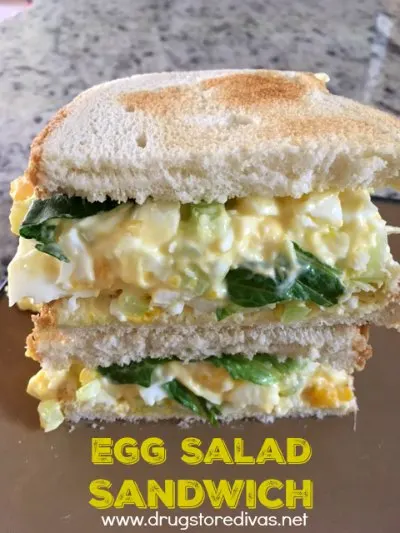 Two halves on an egg salad sandwich on top of each other with the words 