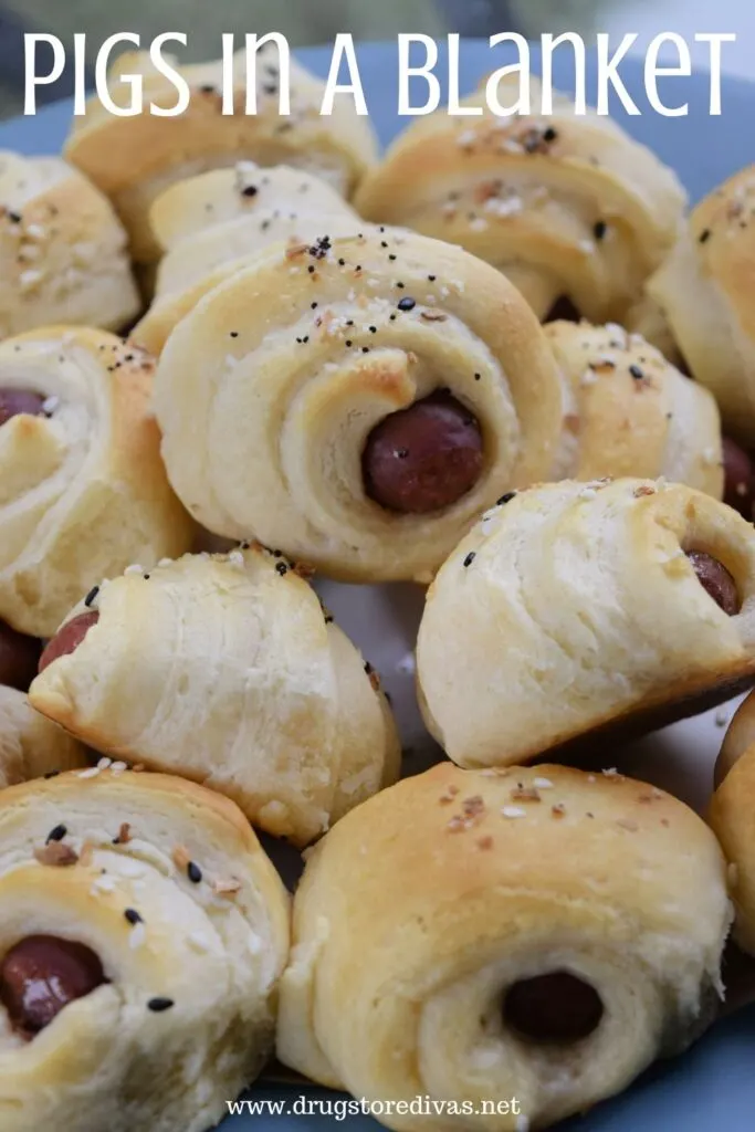 Pigs in a Blanket piled on a plate.