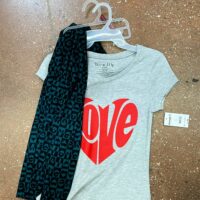 A shirt and leggings that say love with the words 
