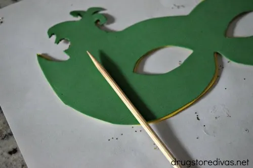 A green DIY Mardi Gras mask.