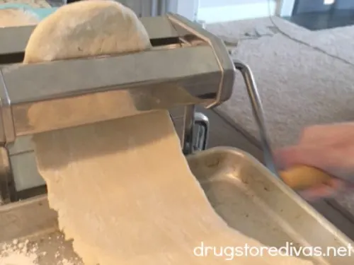 Dough in a hand crank pasta maker.