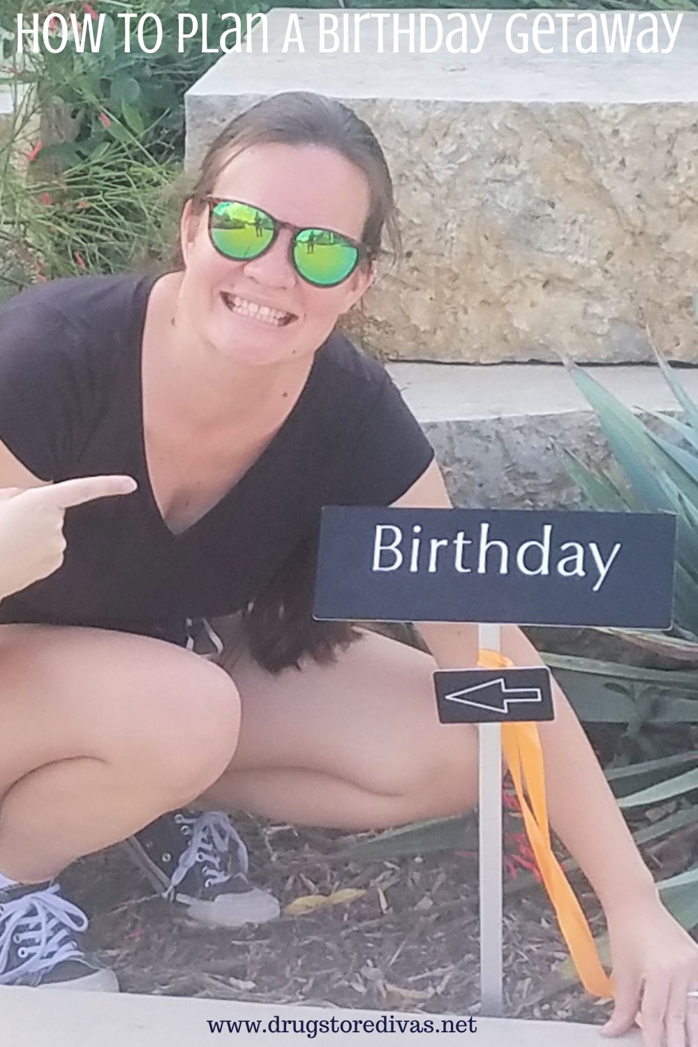 A woman squatting near a sign that says birthday and an arrow pointing at her with the words 